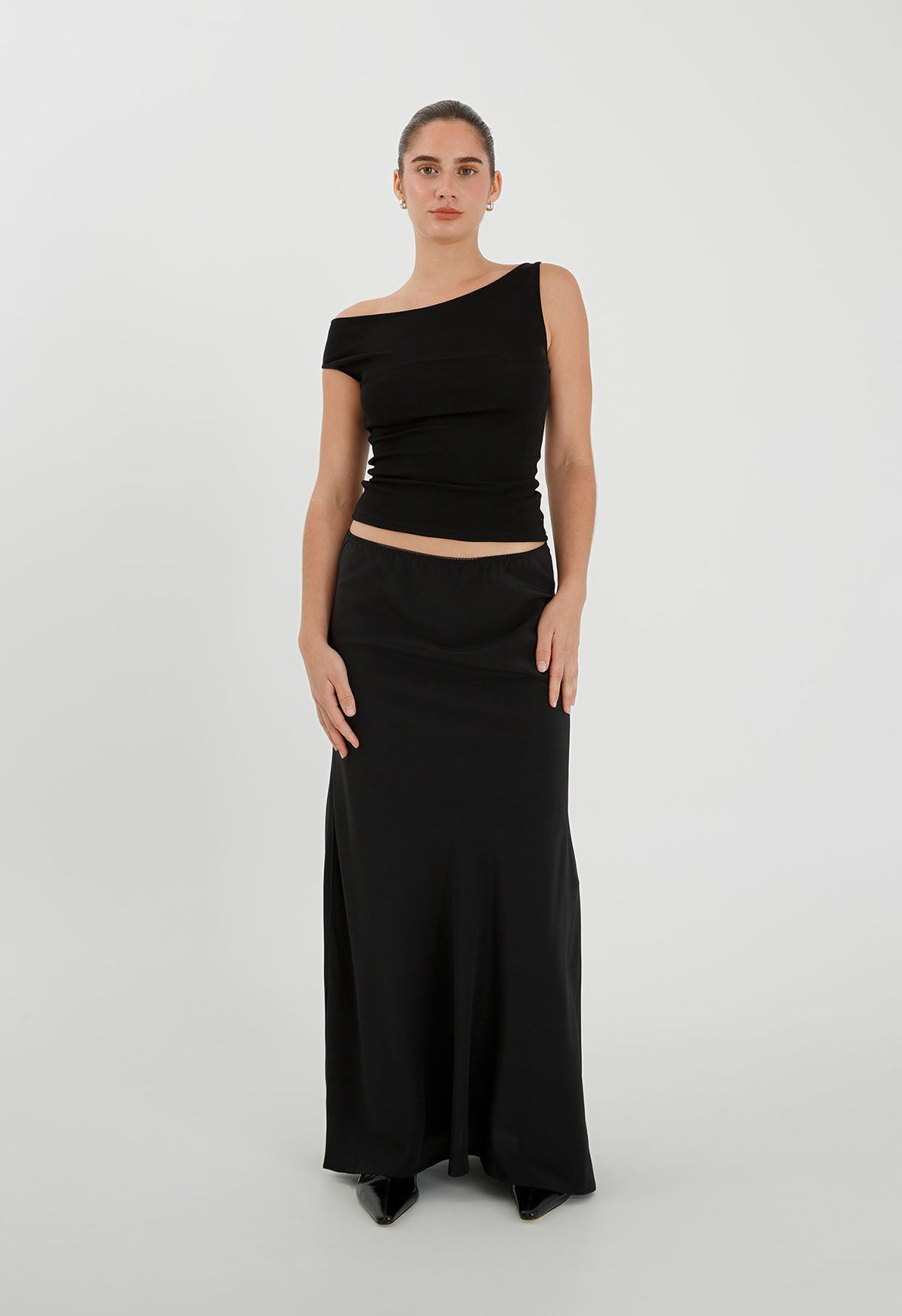 Claudia is wearing a size 6 in the previous production fit