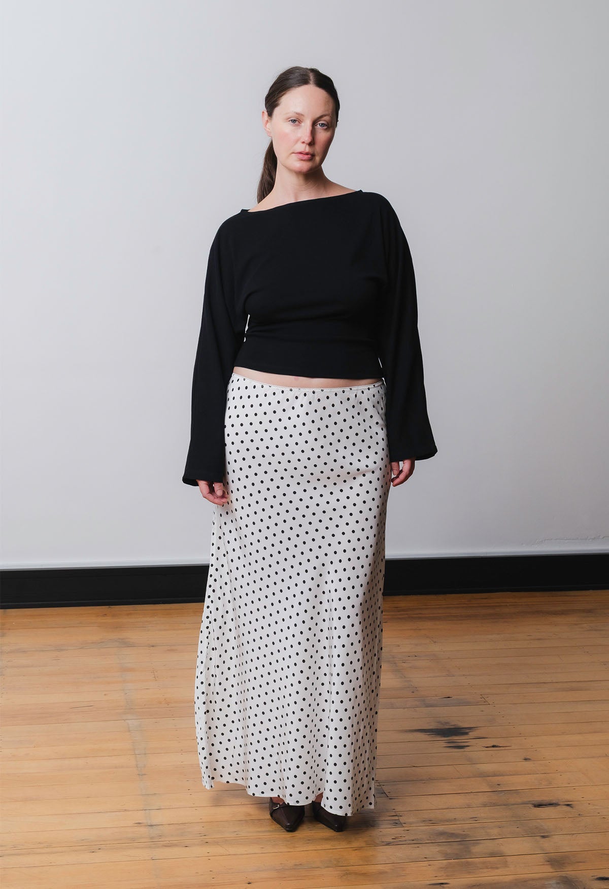Ebony is wearing a size 12 in the previous production fit